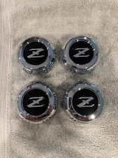DATSUN 280Z/ZX BRAND NEW OEM SET OF 4 WHEEL CENTER CAPS picture